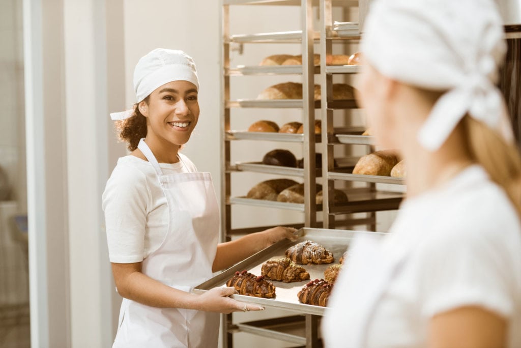 Female bakers working together